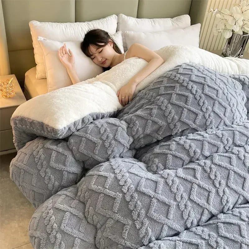 A modern bed dressed with the Slate Grey Weighted Blanket, showcasing its plush coral fleece fabric that provides exceptional warmth and coziness. The sophisticated grey tone adds a sleek, contemporary touch to the bedroom decor. Its anti-pilling feature ensures long-lasting durability, making it perfect for creating a chic and comfortable space.
