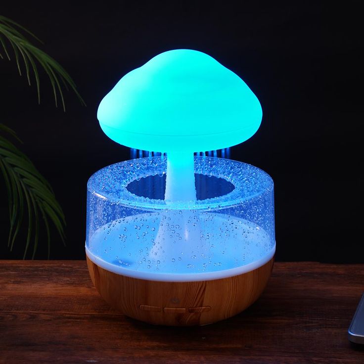 A stylish humidifier designed like a fluffy cloud, gently releasing a mist of vapor, creating a calming and serene atmosphere. The humidifier features soft lighting that mimics the ambiance of a rainy day, perfect for enhancing relaxation and improving air quality in any room.